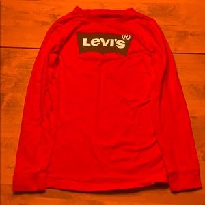 Red Levi’s shirt